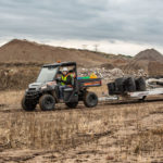 Polaris Commercial PRO XD Full-Size Diesel Utility Vehicle on dirt road.