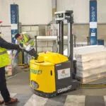 Combilift Combi-CS Counterbalance Stacker Lift Truck lifting pallet outdoors.