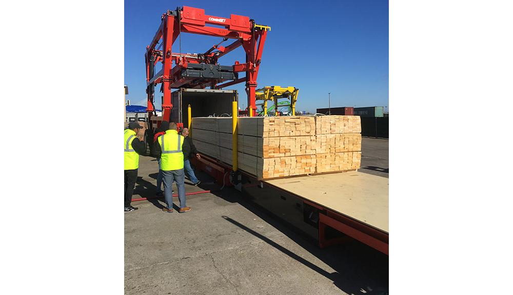 Combilift Combi-CSS container slip sheet holding lumber.