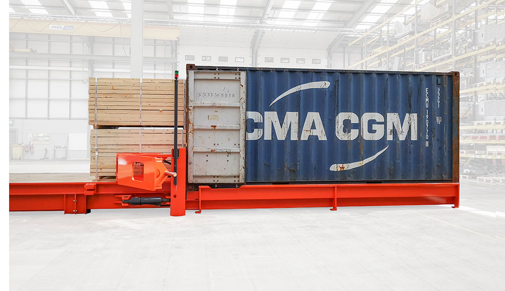Combilift Combi-CSS container slip sheet with lumber and container side view.