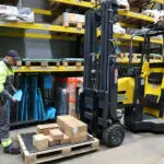 Combilift Aisle Master OP Order Picker with pallet and boxes in warehouse.