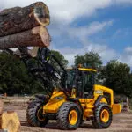 JCB 427 Wheel Loader construction and agriculture truck lifting tree logs.