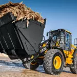 JCB 427 Wheel Loader construction and agriculture truck carrying material on construction site.