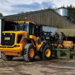 JCB 427 Wheel Loader construction and agriculture truck on farm.