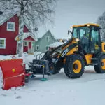 JCB 409 Wheel Loader construction and agriculture truck plowing snow.