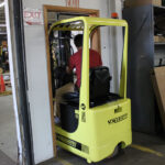 Mariotti ME AC 8c microlift driving through a doorway.