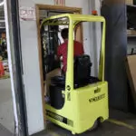 Mariotti ME AC 8c microlift driving through a doorway.