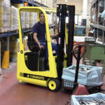 Mariotti ME 8C AC 3 wheel electric Forklift transporting metal parts.