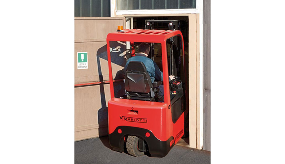 Mariotti MX 16 compact microlift driving into doorway.