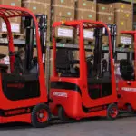 Mariotti MYCROS AC Series Forklifts lined up indoors.