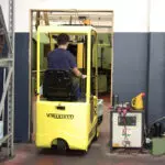 Mariotti ME 8C AC 3 wheel electric Forklift back view in action.