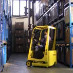 Mariotti ME 8C AC 3 wheel electric Forklift driving in warehouse.