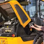 JCB 407 Wheel Loader close up of engine area and operator.