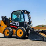 JCB 215 Skid Steer loader with bucket attachment.