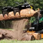 JCB 270T compact track loader lifting log with attachment.