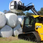 JCB 270T Compact Track Loader lifting agriculture materials.