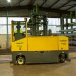 back view of Combilift COMBI-MR4 transporting materials in warehouse.