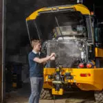 JCB TM-320 articulated telescopic handler engine view with hood up.