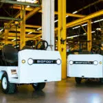 Taylor-Dunn Bigfoot and Bigfoot S in indoor warehouse.