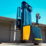 Back of TASK Forklifts CONDA straddle stacker outdoors.