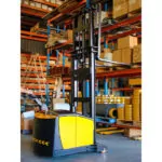 TASK forklifts BOA legless stacker grabbing pallet off warehouse shelf.
