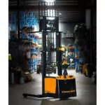 TASK Python Straddle Stacker in warehouse, mast lifted.