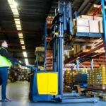 TASK Viper reach truck moving a pallet of goods in a warehouse.