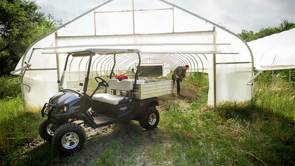 Cushman Hauler 1200X utility vehicle in greenhouse.