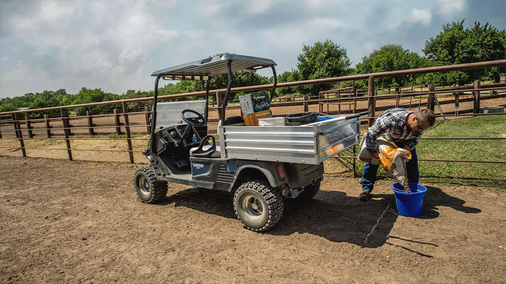Cushman Hauler 1200X utility vehicle with materials in cargo bed.