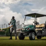 Cushman Hauler Pro utility vehicle in a field.