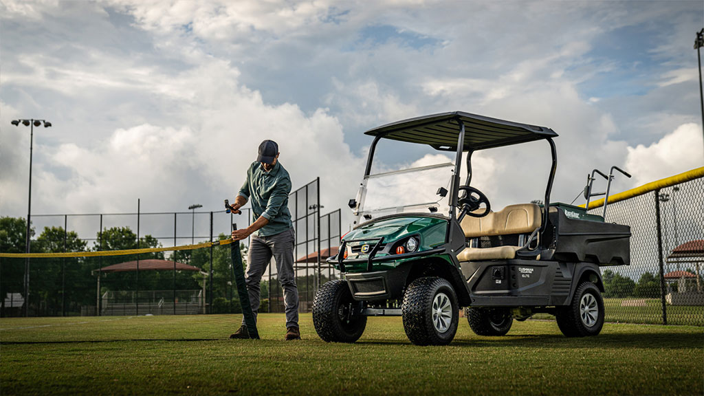 Cushman Hauler Pro utility vehicle in a field.
