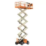 Raised JLG ERT4769 electric rough terrain scissor lift.