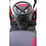Mahindra MAX 26 XLT HST operator controls and steering wheel.