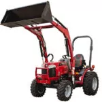 Mahindra MAX 26 XLT HST tractor with bucket loader attachment raised.