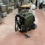 Kodiak K16 walk-behind scrubber with disk deck in baking facility.