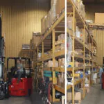 Bendi B40i5 forklift in narrow aisled warehouse.