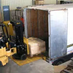 Bendi B30AC forklift driving into semi trailer.