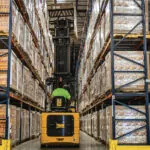 Bendi B40AC-HL forklift in warehouse narrow aisles.