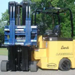 Bendi B55AC forklift truck with fork attachments.