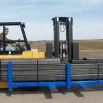 Drexel R60i5 lift truck transporting long load.