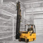 Drexel SL60AC placing pallet onto warehouse racking.