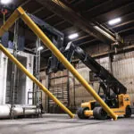 Landoll PT40 precision telehandler in warehouse raising beams.