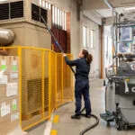 Nilfisk VHB436 Industrial Vacuum cleaning vents in warehouse facility.