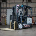 RICO EX AC counterbalance forklift in warehouse.