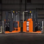 RICO EX Straddle and Reach trucks in warehouse.