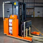 Stand-on Rider RICO EX straddle forklift.