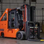 RICO IC Pegasus lift truck with cab in warehouse.