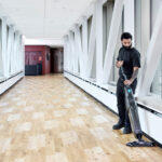 Dryft micro scrubber cleaning hallway floors.
