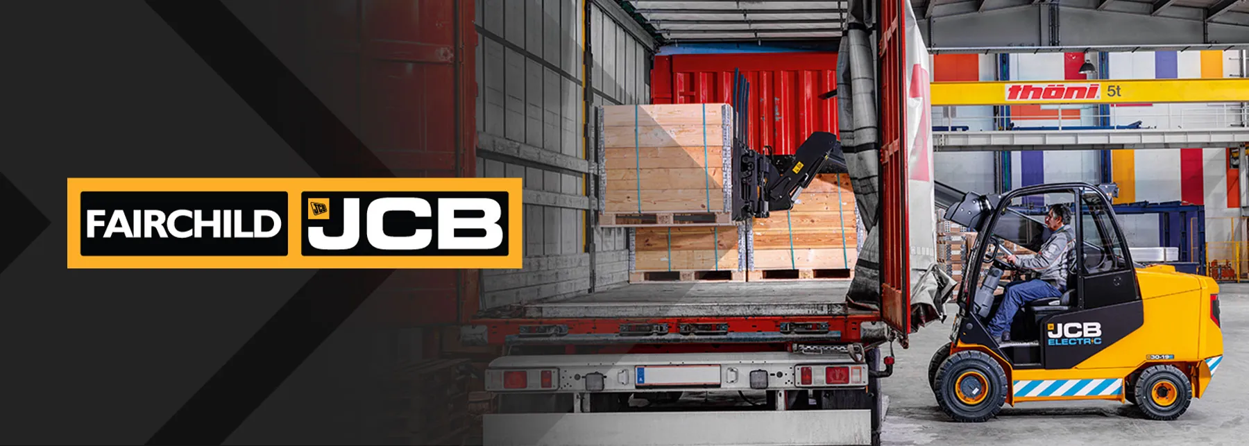 JCB Teletruk lifting crate off truck trailer.