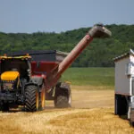 JCB 8330 Fastrac agricultural tractor doing fieldwork.